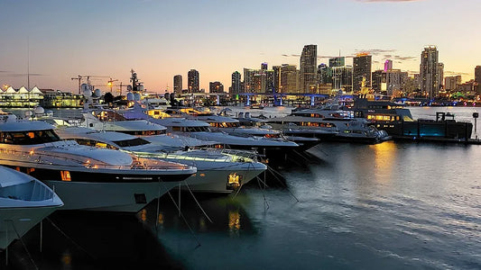 Miami Boat Show 2024 marina at dusk with Miami skyline where KORKZ custom floating sunglass straps were exhibited to boaters and fishing enthusiasts