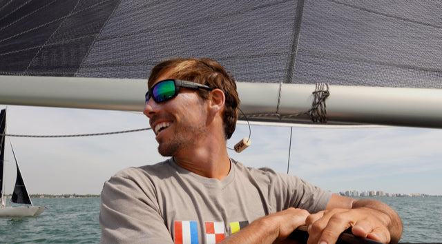 Billy from Tula's Endless Summer sailing YouTube channel wearing a KORKZ custom wine cork sunglass strap