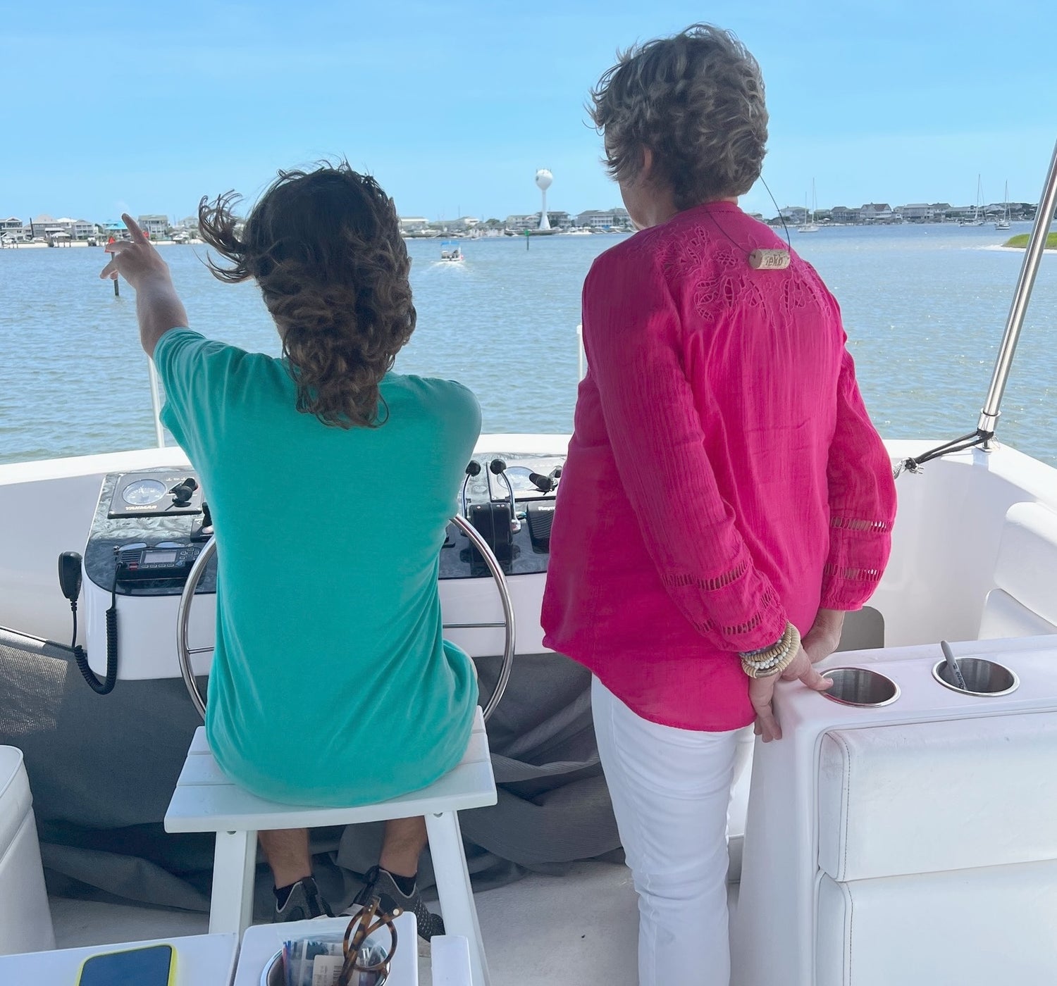 Woman wearing KORKZ custom wine cork sunglass strap on a boat on the Intracoastal Waterway North Carolina